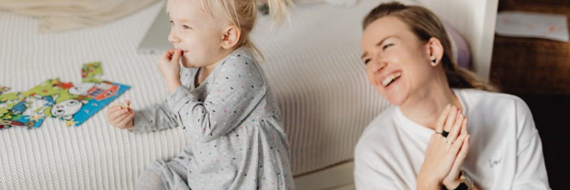 Joyful mother and daughter bonding during playtime indoors. Captured in a cozy home environment.